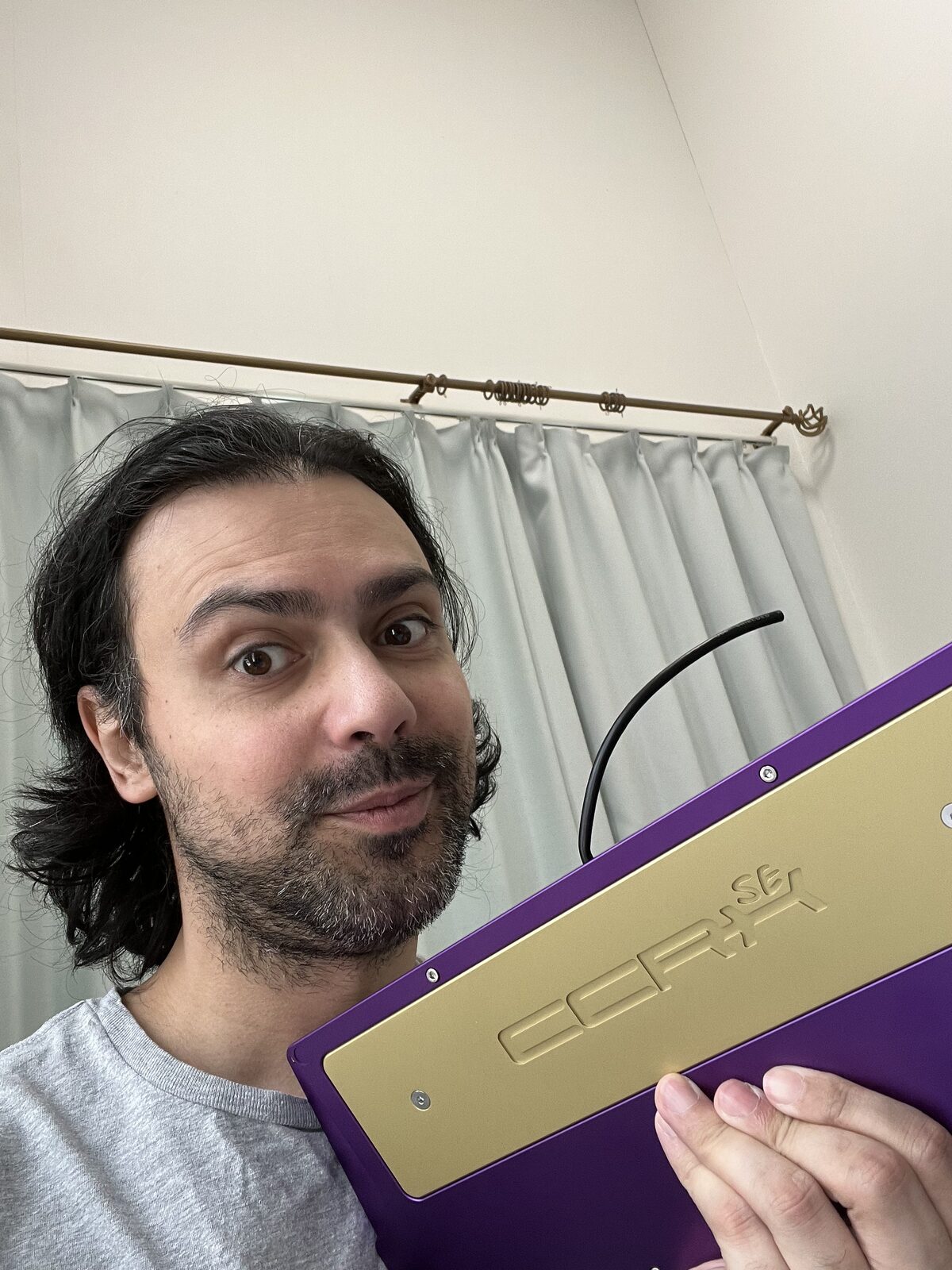 Simon holding a keyboard